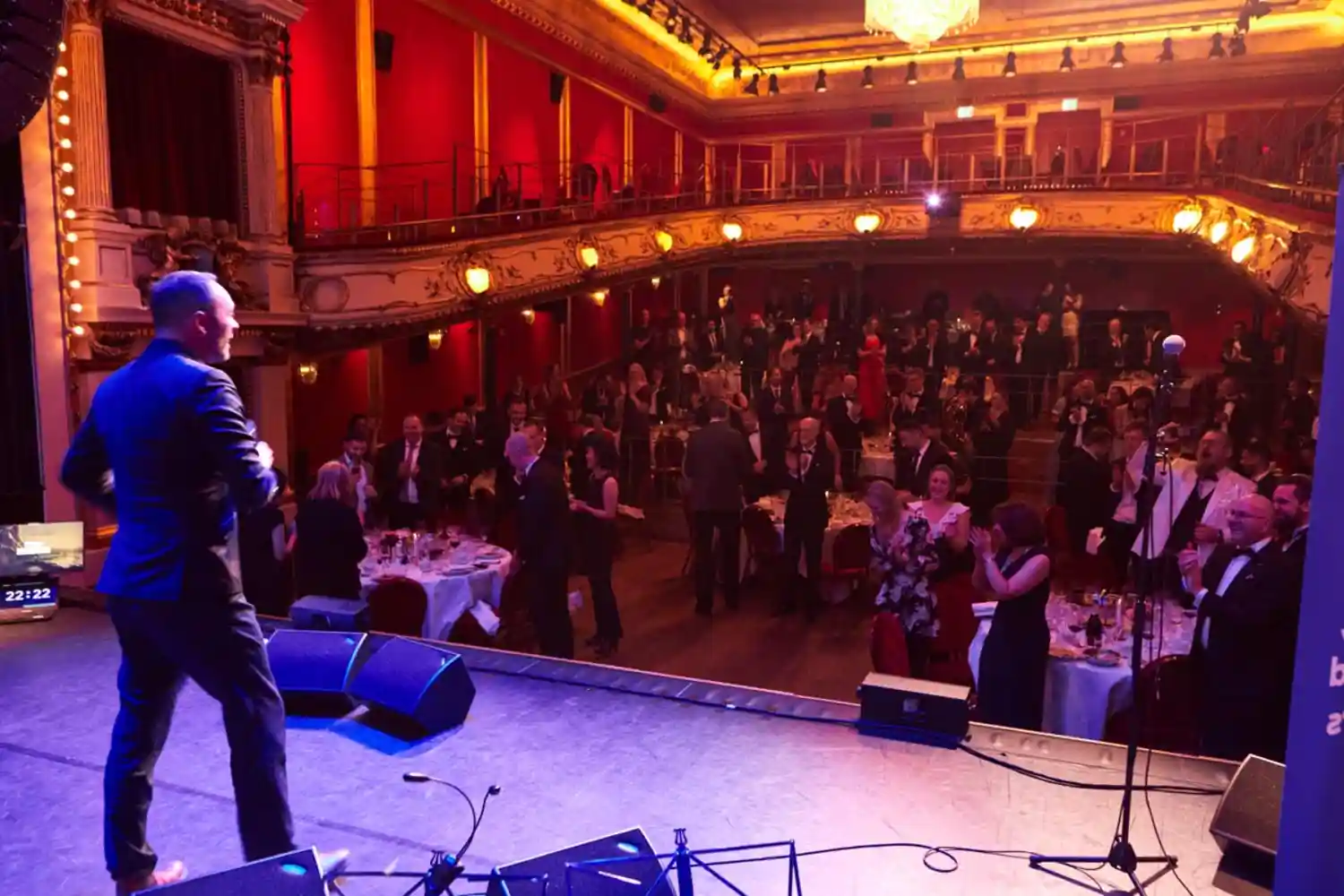 A presenter on stage speaking to an audience during the 2026 Nordic Data and AI Readiness (DAIR) Awards ceremony co-located with the Data Innovation Summit in Stockholm.